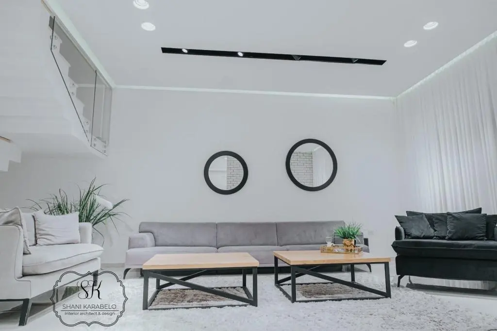 Home Remodeling converting an unfinished basement into a functional living area with lighting and flooring